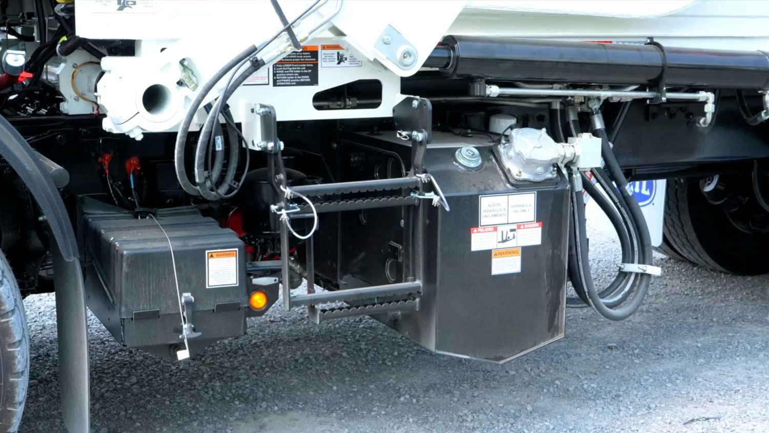 How do you check hydraulic oil levels on a Heil garbage truck tutorial video
